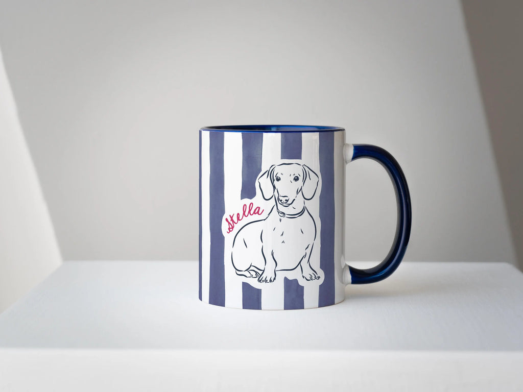 Mug with a dachshund illustration and 'Stella' text on a white background