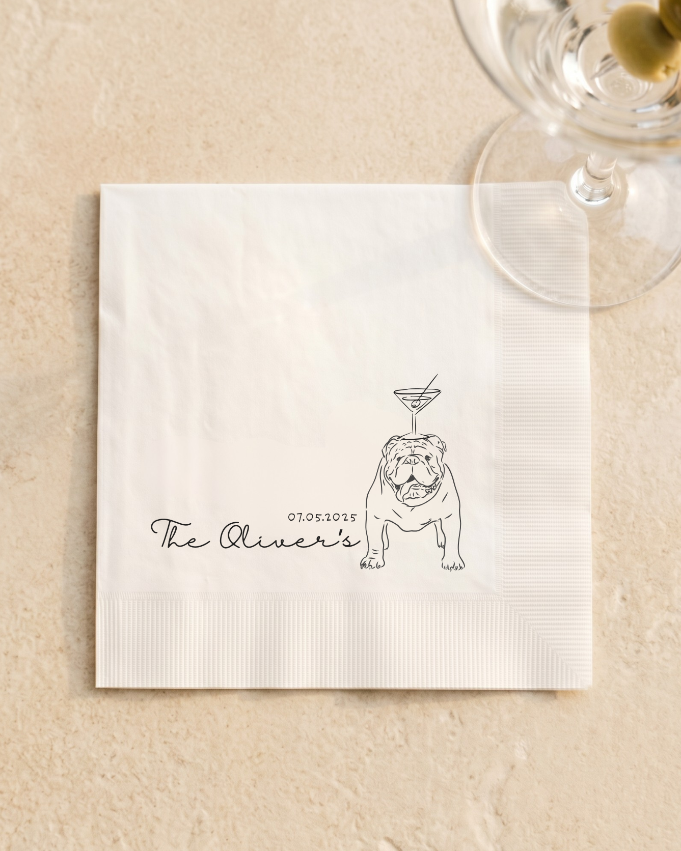 Napkin with a bulldog illustration and 'The Oliver's' text on a beige background