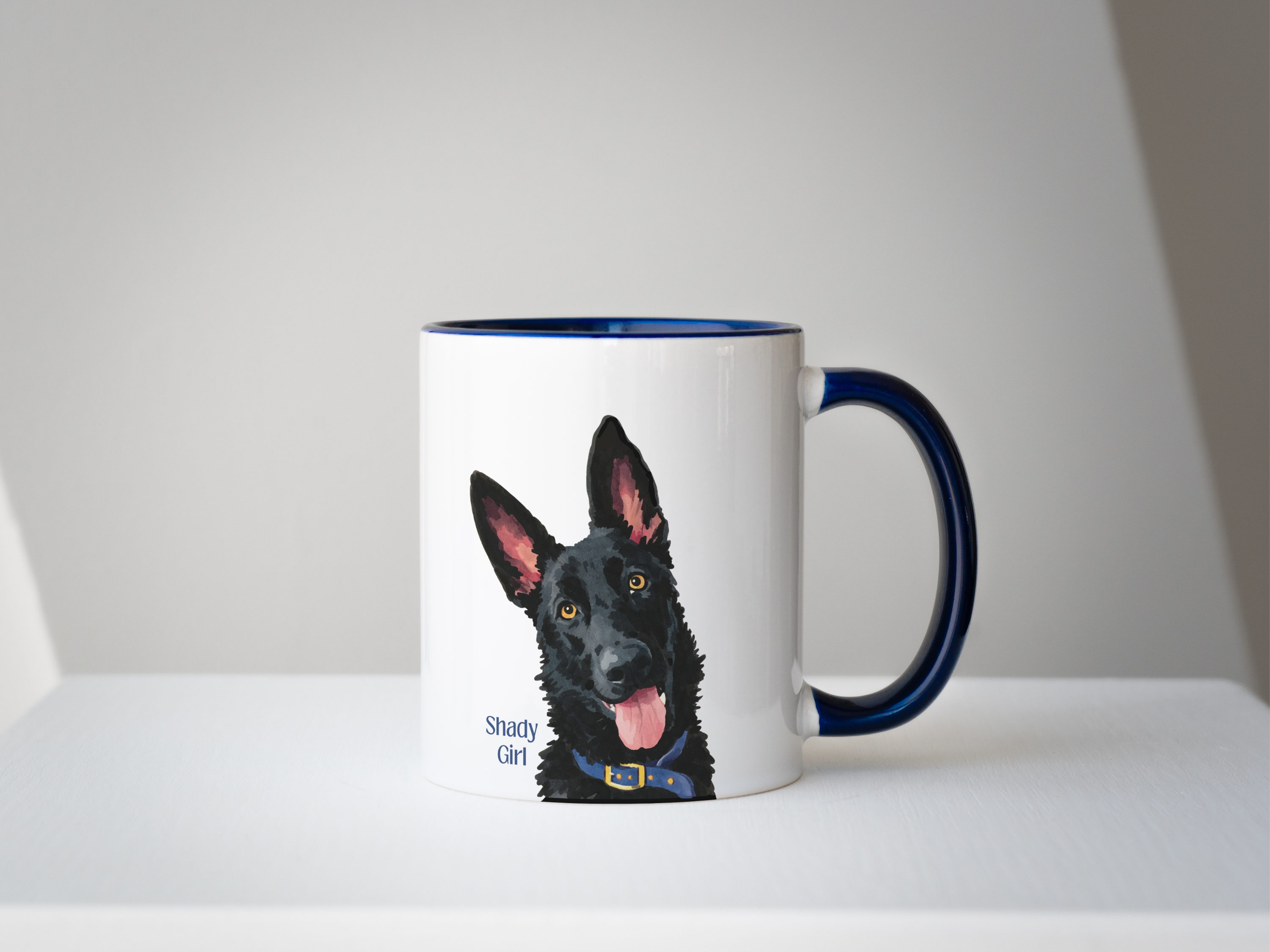 Mug with a dog illustration and a circular photo of a real dog, on a white surface.