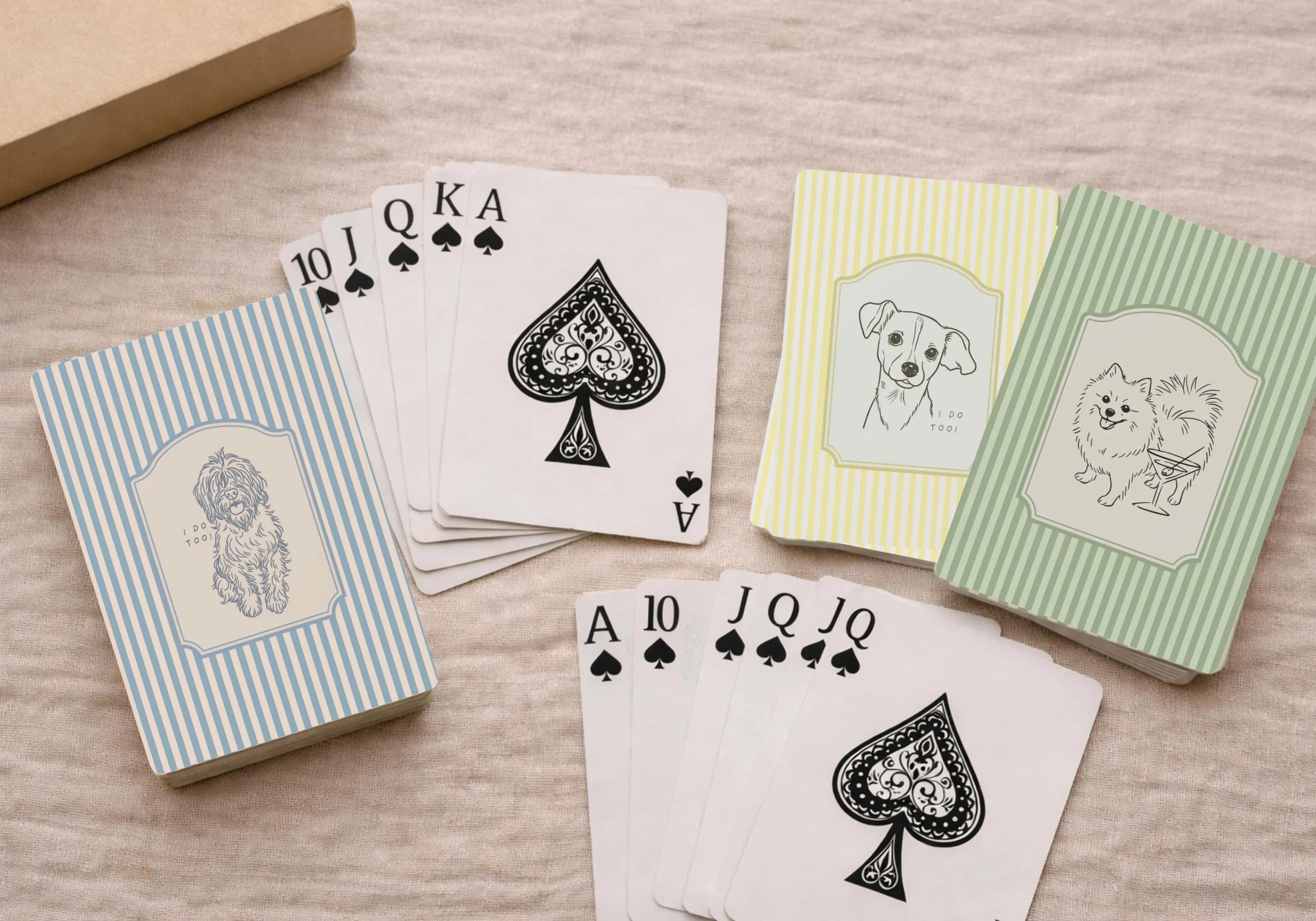 Playing cards with dog illustrations on a wooden surface