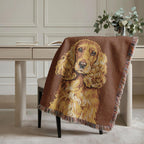 Brown blanket with a dog design draped over a chair in a room with a desk and plants.