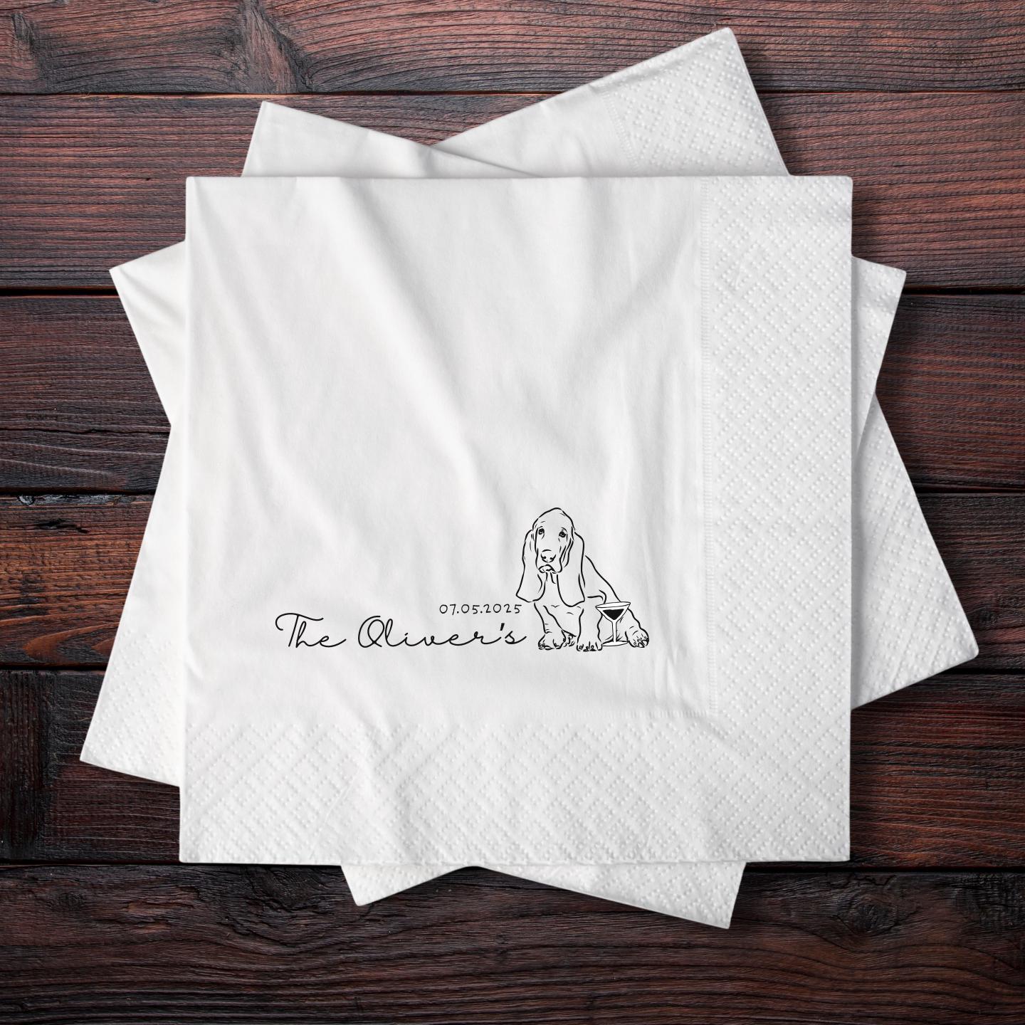 White cocktail napkin with a dog illustration and text on a wooden surface