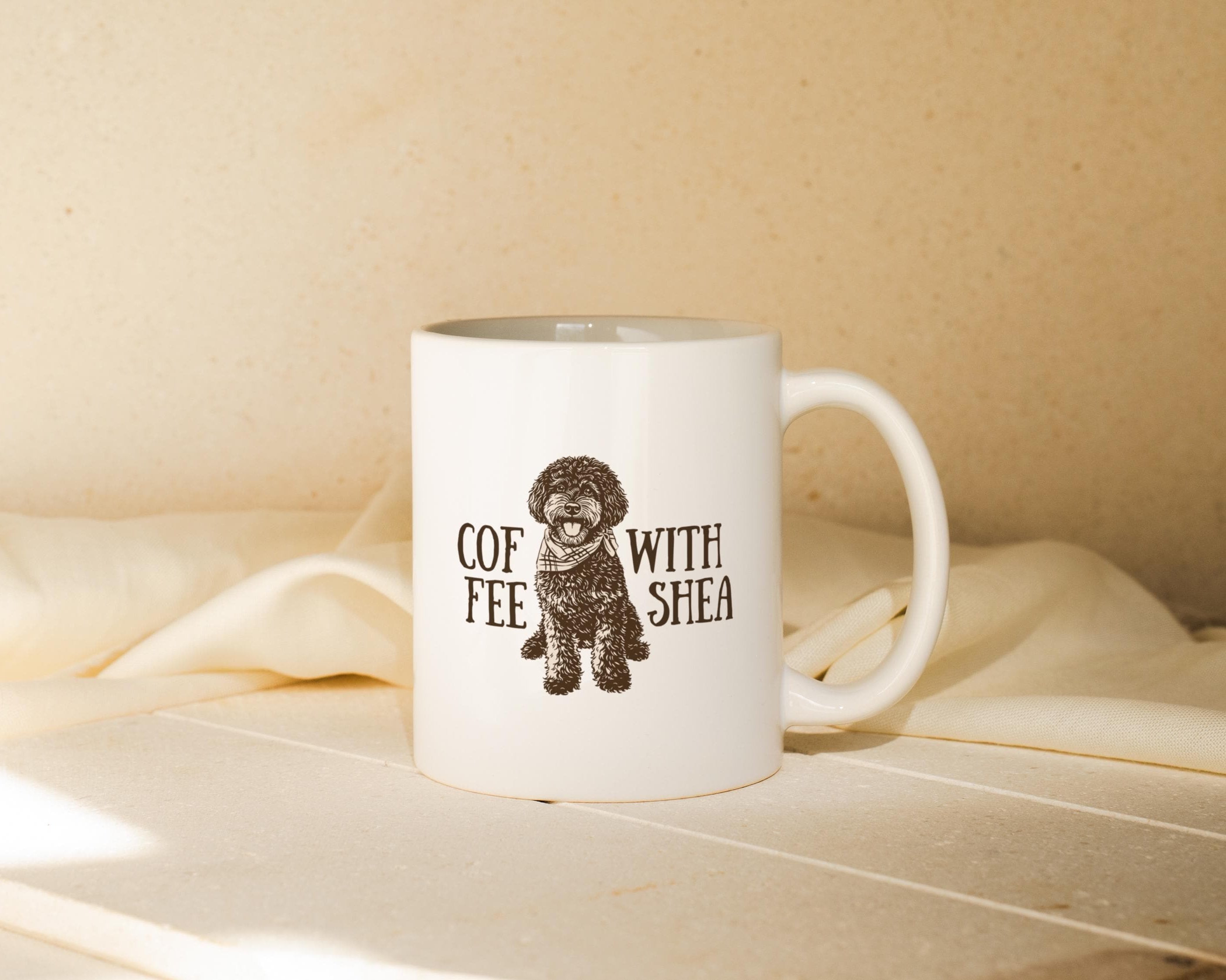 White mug with a brown dog illustration and text on a beige surface