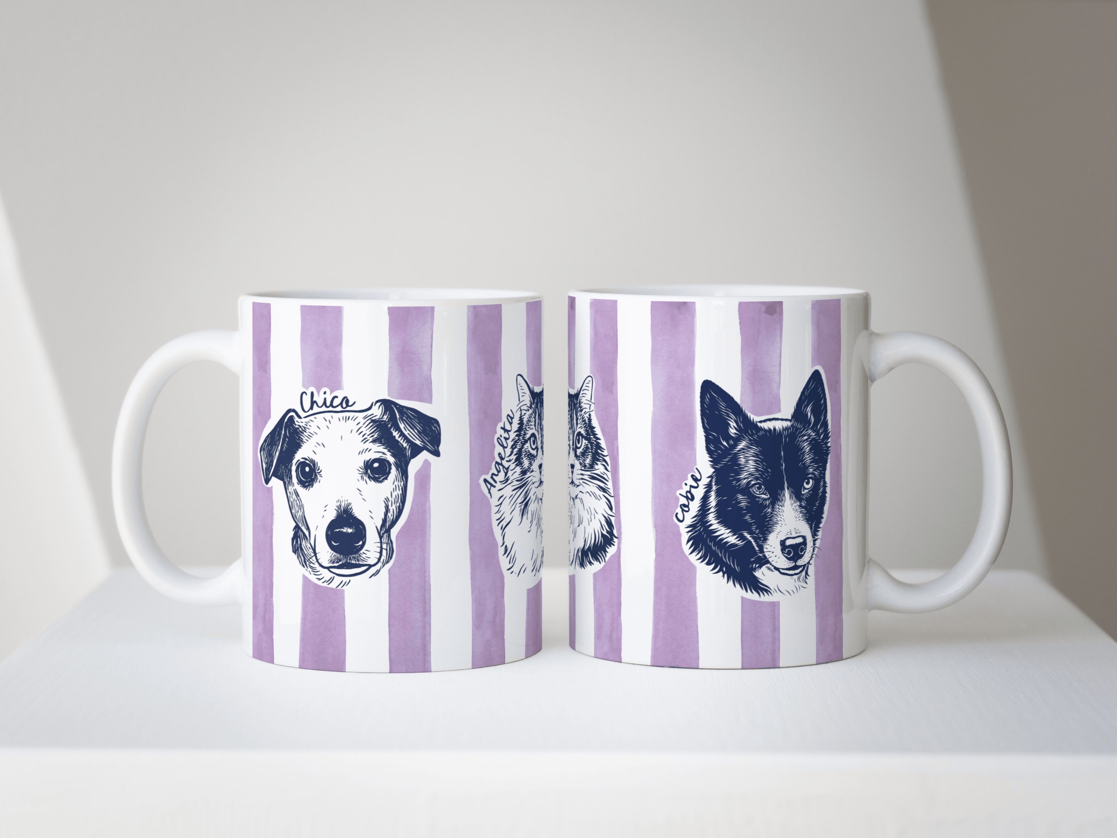 Two mugs with striped design featuring dog illustrations on a white surface.