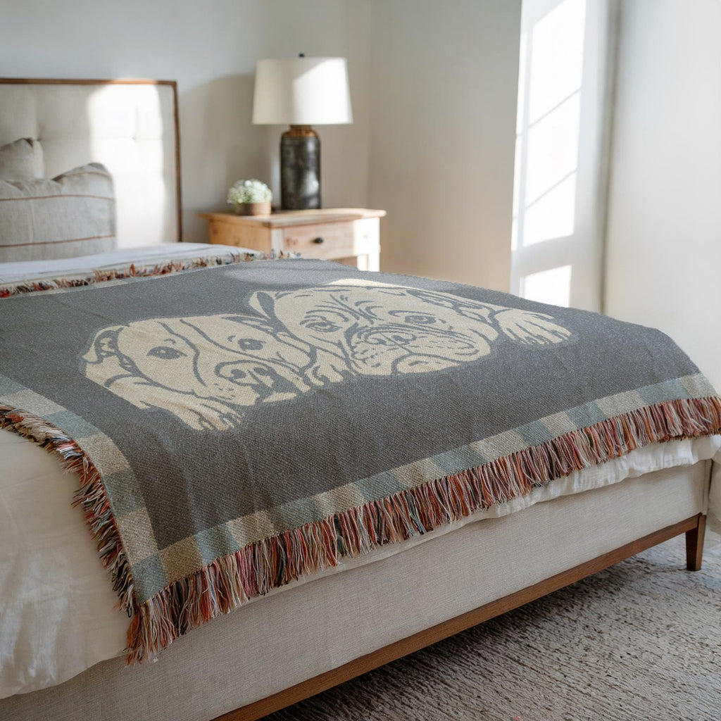 Gray patterned throw blanket on a bed in a bedroom setting