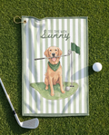 Golf towel with a dog illustration and text on a grass background