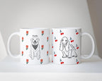 Two white mugs with dog illustrations and tulip flower pattern and cherry pattern on a white surface.