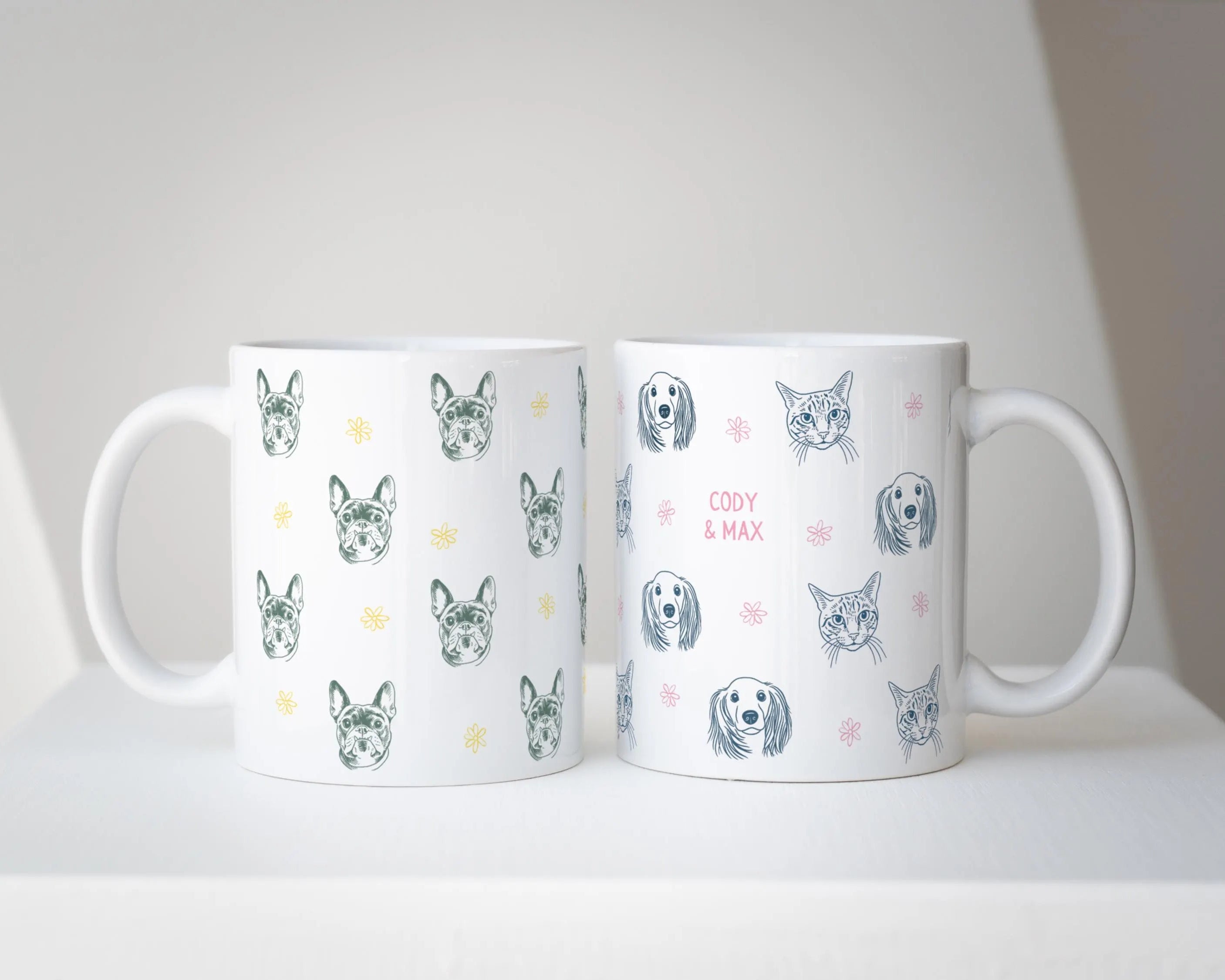Two mugs with dog pattern designs on a white surface.