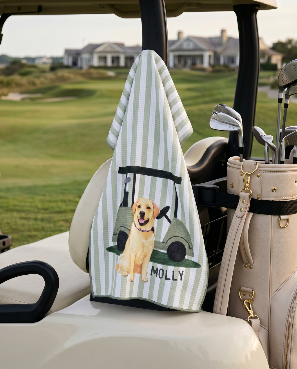 Golf towel with a yellow lab dog illustration and 'Molly' text on a golf cart