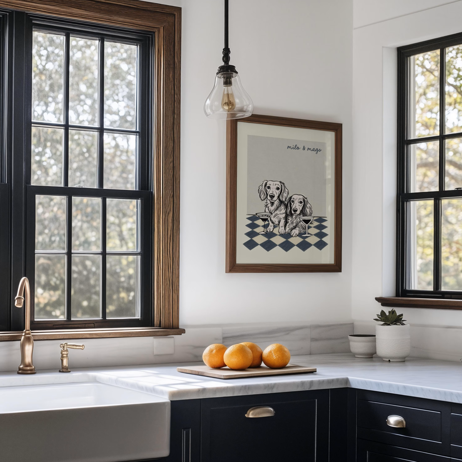 Modern kitchen with black windows, marble countertop, and framed artwork.
